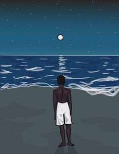 a man standing on the beach at night