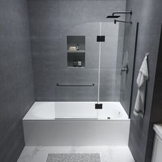 a white bath tub sitting next to a walk in shower