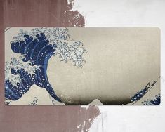 an image of the great wave in blue and white on a beige background with some paint splatters