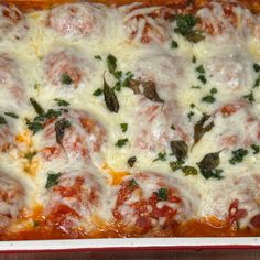 a casserole dish with meatballs and cheese on top, ready to be eaten