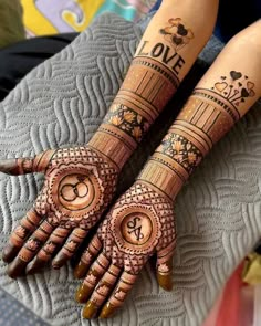 two hands with henna tattoos on them and the words love are written in arabic