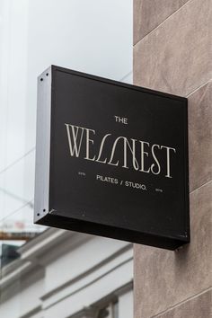 the sign on the side of a building that says the weinesst pilates studio