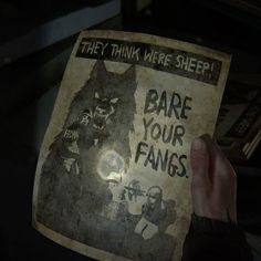 someone holding up an old poster with the words dare your fangs