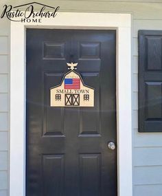 a black door with an american flag on it