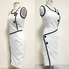 two views of a white dress with black details on the front and back, one showing buttons