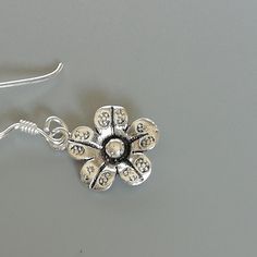 A PAIR of sterling silver flower ear danglers. Dimensions: 10 x 10 mm Drop length:22 mm Weight: 1.42 gm Price listed is for a PAIR of hoops. These earrings are made of 925 hypoallergenic sterling silver and comes with a 925 stamp. Can be packaged in a gift box. I can include a personal message from you if needed You are welcome to contact me at... bhavnakwintra1956@gmail.com For more beautiful pieces from my shop, please browse 👇 TOE RINGS: https://www.etsy.com/your/shops/TheSilverGame/tools/li Sterling Silver Flower-shaped Jewelry With Matching Earrings, Sterling Silver Flower-shaped Earrings, Silver Flower Jewelry With Matching Earrings, Delicate Sterling Silver Flower Earrings For Jewelry Making, Nickel-free Sterling Silver Flower-shaped Earrings, Silver Flower Earrings For Pierced Ears, Sterling Silver Flower Charm Earrings As Gift, Sterling Silver Flower Charm Earrings For Anniversary, Dainty Sterling Silver Flower-shaped Earrings