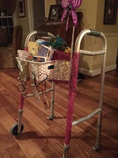 a shopping cart filled with lots of items on top of a hard wood floored floor