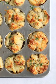 a muffin tin filled with lots of different types of food