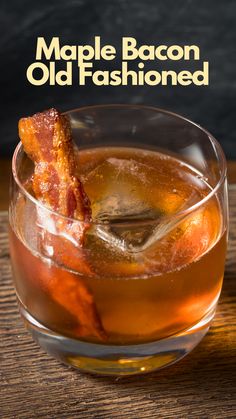 a close up of a drink in a glass with bacon on the rim and text that reads maple bacon old fashioned