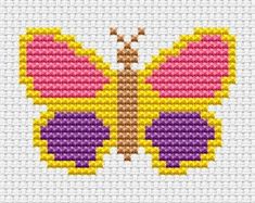 a cross stitch butterfly with pink and yellow wings