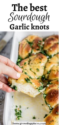 the best sourdough garlic knots recipe is made with bread, cheese and herbs