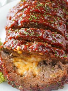 the meatloaf is stuffed with cheese and sauce