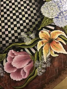 a painting of flowers on a black and white checkerboard background