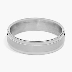 a silver ring on a white background