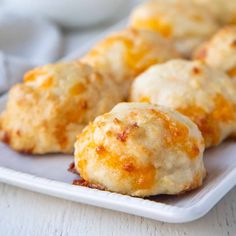 some biscuits are sitting on a white plate and ready to be eaten by someone else