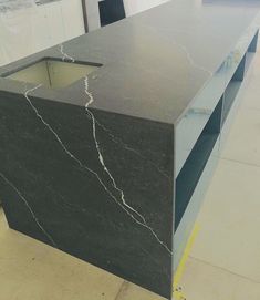 a black marble counter top in a store