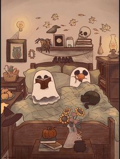 two ghost pillows on a bed in a room with pumpkins and other halloween decorations