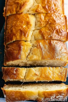 sliced loaf of bread sitting on top of a cutting board