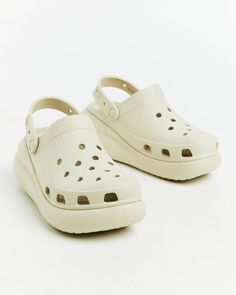 The Classic Platform Clogs by Crocs come in a bone colourway. The clogs are crafted from a water-friendly, buoyant and lightweight fabrication and feature ventilation ports, platform base and pivoting heel straps. Teen Shopping, Destination Dress, Platform Clogs, Jersey Top, Skirted Swimwear, Strap Heels, Denim Shop, Playsuit Jumpsuit, Denim Women