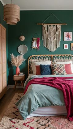 a bedroom decorated in teal and pink