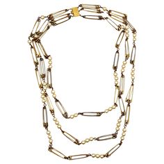 MOSCHINO vintage rare gold tone necklace featuring 3 strands of safety pin links alternating with resin faux pearls. Box clasp. Embossed MOSCHINO. Indicative measurement : length approx. 84 cm (33.07 inches) / with of safety pin : 0.8 cm (0.31 inch). Material : Gold tone metal hardware / Resin faux pearls. NOTES - This is a preloved vintage item, therefore it might have imperfections. - Colors may differ slightly from actual product appearance due to differences in lighting conditions. - As a bu Moschino Vintage, Box Clasp, Gold Tone Necklace, Gianni Versace, Multi Strand Necklace, Metal Hardware, Measurement Length, Strand Necklace, Safety Pin