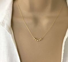 IF YOU LIVE OUTSIDE THE US AND WOULD LIKE TO ORDER FROM MY SHOP, PLEASE MESSAGE ME FOR DETAILS. Dainty Gold Bead Necklace, 14K Gold Fill Ball Necklace, Sterling Silver Bead Necklace, Small Gold Beads Necklace, Delicate Chain Necklace, Layering Necklace Minimal in design this dainty necklace consists of your choice of 4mm Beads on a delicate 14k Gold filled or Sterling Silver chain. Bead Choices are: Shiny 14k Gold Filled or Sterling Silver Star Dust 14k Gold or Sterling Silver Corrugated (Groove Gold Beads Necklace, Star Dust, Silver Bead Necklace, Necklace Layering, Gold Bead Necklace, Ball Necklace, Delicate Chain, Color Stone, Layering Necklace