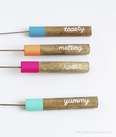 three different colored wooden utensils with writing on them that say toasty, melting, roast and yummy