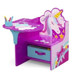 a children's desk and chair with a unicorn design on the top, in purple