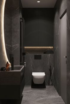 a modern bathroom with marble walls and flooring