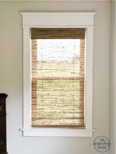 a bathroom window with blinds in it