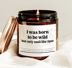 a candle with a label that says i was born to be wild but only until like 9pm