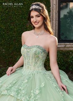 Look breathtaking in this embroidered applique long strapless bell sleeve dress with A-line skirt by Rachel Allan RQ2178. Glitter tulle quinceanera ball gown features corset bodice with beaded strapless neckline, applique and beading details, detachable puff sleeves, and lace-up back closure. The dress has a skirt overlay in the front and 3-tier bubble skirt in the back with a sweep train. Matching bolero jacket is included. Strapless Bell Sleeve Quinceanera Dress by Rachel Allan RQ2178 Rachel A Prom Dresses Sparkly, Bubble Design, Rachel Allan, Sequin Appliques, Quinceanera Dress, Corset Bodice, Corset Lace, Bubble Skirt, Sweet 16 Dresses