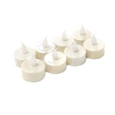 six white candles are lined up in a row on a white surface, with one candle turned upside down