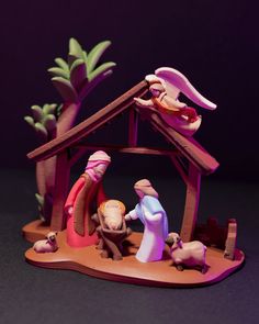 a nativity scene with figurines of the birth of jesus and baby jesus