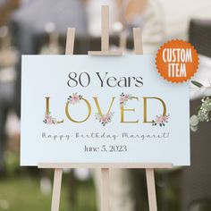 a sign that says 90 years loved on it