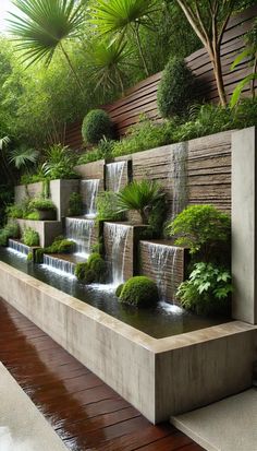 an outdoor garden with water features and greenery on the walls, along with wooden flooring