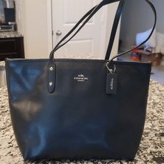 Almost Brand New, Polished Pebble Leather Tote. Not Too Big, Not Too Small, This Is The Perfect Carry-It-All Tote With Space For All Of Your Day-To-Day Essentials. Crafted Of Polished Pebble Leather, It Features Two Open Pockets, A Secure Center Zip Compartment And Slender Shoulder Straps Designed With A Longer Drop To Fit Comfortably Over Coats. Coach Black Shoulder Bag With Snap Closure, Black Coach Shoulder Bag With Snap Closure, Over Coats, Polished Pebble, Bags Coach, Everyday Tote, Casual Everyday, Black Casual, Womens Tote Bags