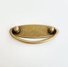 an old brass door handle on a white background