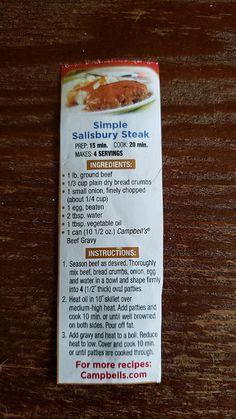 a packet of salted steak sitting on top of a wooden table