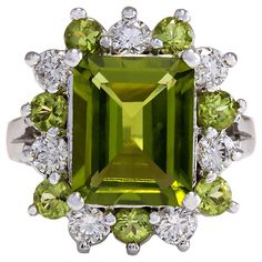 Indulge in the natural beauty of our 4.97 Carat Natural Peridot 14 Karat White Gold Diamond Ring. Crafted with exquisite attention to detail, this ring is a true testament to luxury and sophistication. The centerpiece of this stunning ring is a captivating natural peridot, weighing 4.27 carats and measuring 11.00x9.00mm. Its vibrant green hue adds a refreshing pop of color, making it a standout feature of the design. Surrounding the peridot are dazzling natural diamonds, totaling 0.70 carats. Wi Colored Jewelry, 14k White Gold Diamond Ring, Gemstone Diamond Ring, Princess Cut Gold, Peridot Jewelry, Gold Diamond Ring, White Gold Diamond Rings, Peridot Ring, Peridot Gemstone