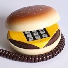 an old fashioned hamburger phone is sitting on a table