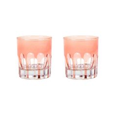 two pink glasses sitting next to each other