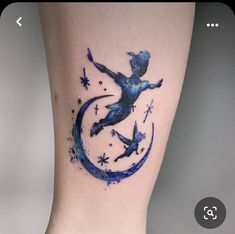 a tattoo on the leg of a woman with stars and a bear in the moon