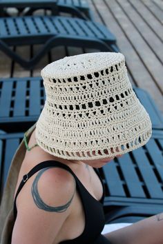 Embrace the latest trend with our handmade, unique Raffia Bucket Hat. Crafted from 100% environmentally friendly raffia yarn, this hat provides excellent sun protection while being incredibly light and comfortable. It's designed to keep you cool and prevent sweating even in the hottest weather. Perfect for poolside lounging, beach days, city outings, or any hot summer activity, this Raffia Bucket Hat effortlessly complements your trendy look. Versatile in style, you can wear it as a classic bucket hat or fold the brim up to sport a sailor hat look. MATERIAL: 100% natural raffia SIZE: Diameter: 20 cm (7.8 inches), suitable for standard adult size. COLOR: Personalize your hat by choosing your favourite colour, 14 colours available: Ivory; White Oak; Daffodil; Lemon; Green Tea; Mineral Green; Natural Handwoven Bucket Hat, Handwoven Beige Brimmed Bucket Hat, White Handwoven Hat For Beach, White Handwoven Beach Hat, Vacation Hat With Curved Brim, Woven Yarn Hat For Vacation, Handwoven Natural Bucket Hat, White Brimmed Straw Crochet Hat, One Size Yarn Hat For Vacation