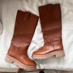 Brand New, Never Worn! Size 38.5, Cognac Color, Nicoletta Style Nothing Wrong With Them. Bought And Literally Just Have Never Worn! Does Not Come With Box, Threw It Away Details From Site: This Season Brings A New Take On The Riding Boot: A Tall, Below-The-Knee Boot With A Thick, Modern Lug Sole. Make A Style Statement, And Walk Comfortably All Day Long. Soft Italian Calf Leather Upper Fully Lined In Calf Leather Pull On And Off With Ease With 2 Pull Tabs A Thick, Modern Sole In Surprisingly Lig Brown Boots With Removable Insole And Flat Heel, Chic Brown Boots With Leather Footbed, Brown Boots With Padded Heel For Workwear, Brown Boots With Padded Heel For Work, Chic Brown Calf Leather Boots, Brown Workwear Boots With Padded Heel, Brown Calf Leather Boots With Flat Heel, Brown Leather Boots With Padded Heel, Knee-high Cognac Leather Boots