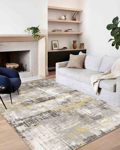 a living room with a couch, chair and fireplace