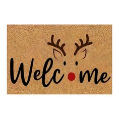 a welcome mat with reindeer antlers and the word welcome on it's side