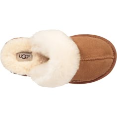 The UGG® Cozy II is a casual kids' suede lined with fluffy, soft wool and is super easy to slip on and off. These UGG® Cozy II Chestnut Suede Kids' Slippers have the following features: Suede upper Sheepskin collar 17mm UGGplush 80% upcycled wool, 20% lyocell lining or 17mm UGGplush 60% upcycled wool, 40% lyocell lining 17mm UGGplush 80% upcycled wool, 20% lyocell insole or 17mm UGGplush 60% upcycled wool, 40% lyocell insole SugarSole outsole, made with ethylene from sugarcane, or Treadlite by U Ugg Cozy, Shoes For Teens, School Wishlist, 2024 Shoes, Baggallini Bags, Bday Wishlist, Pretty Shoes Sneakers, Athleisure Sneakers