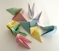 several origami birds sitting on top of each other