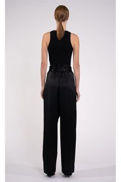 The Rhett Pant is a minimal, yet eye-catching pant. The luxurious fabric drapes beautifully, creating a sleek and polished look that's perfect for any occasion. The double belt design adds a touch of unique style, cinching the waist for a flattering and feminine silhouette. These high-waisted pants are perfect for anyone looking to add some sophisticated and stylish flair to their wardrobe. Skirt Swimsuit Coverup, White Jumpsuit Dress, Double Belt, Hemant And Nandita, Skirt Swimsuit, Cami Nyc, Floral Gown, Belt Design, Luxurious Fabric